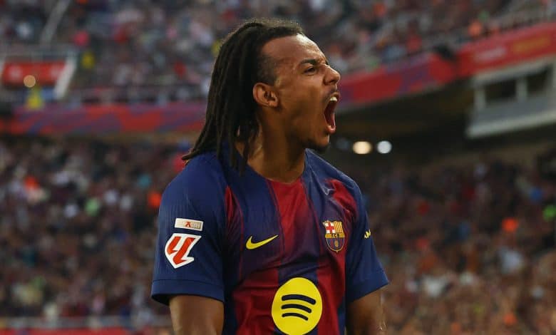 Vibrant image of a passionate football player in FC Barcelona kit celebrating on the field during a match, showcasing sports enthusiasm and team spirit.