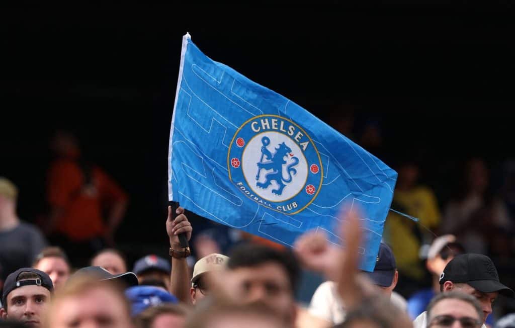Chelsea Football Club flag at a sports event, showcasing team pride and supporter enthusiasm.