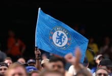 Chelsea Football Club flag at a sports event, showcasing team pride and supporter enthusiasm.