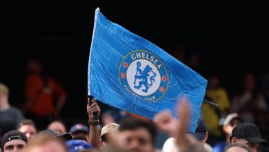 Chelsea Football Club flag at a sports event, showcasing team pride and supporter enthusiasm.