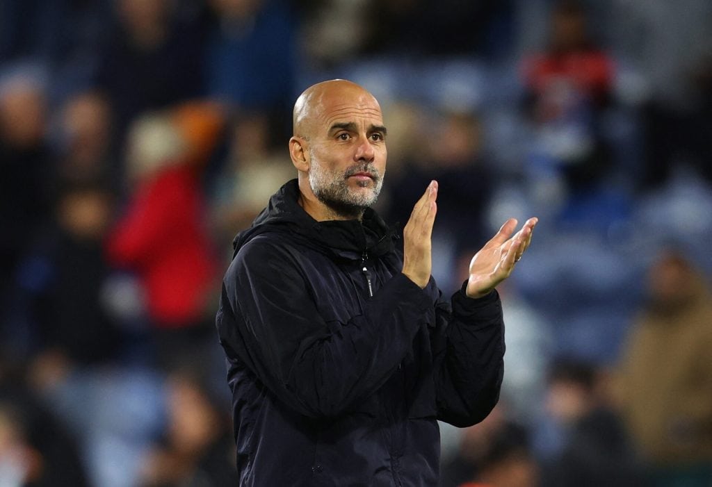 Viral football coach applauds fans during match, passionate team management, sportsmanship, soccer game action, athlete leadership, stadium crowd, sports event, passionate coaching, football strategy, game day atmosphere.