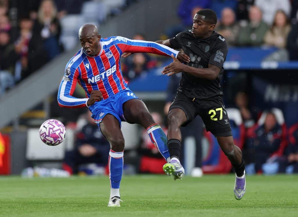 Palace shine in Europe: Record-Breaking Run Continues Dynamic soccer match action with two players competing for ball possession on the field.