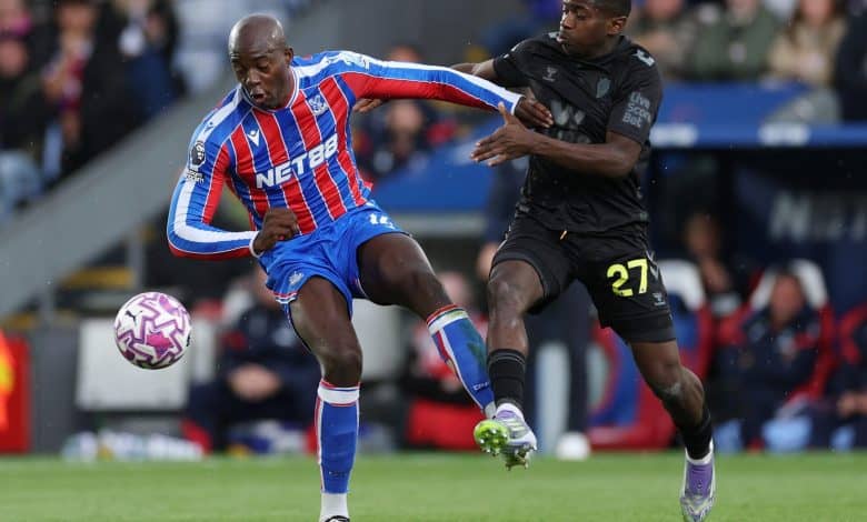 Palace shine in Europe: Record-Breaking Run Continues Dynamic soccer match action with two players competing for ball possession on the field.