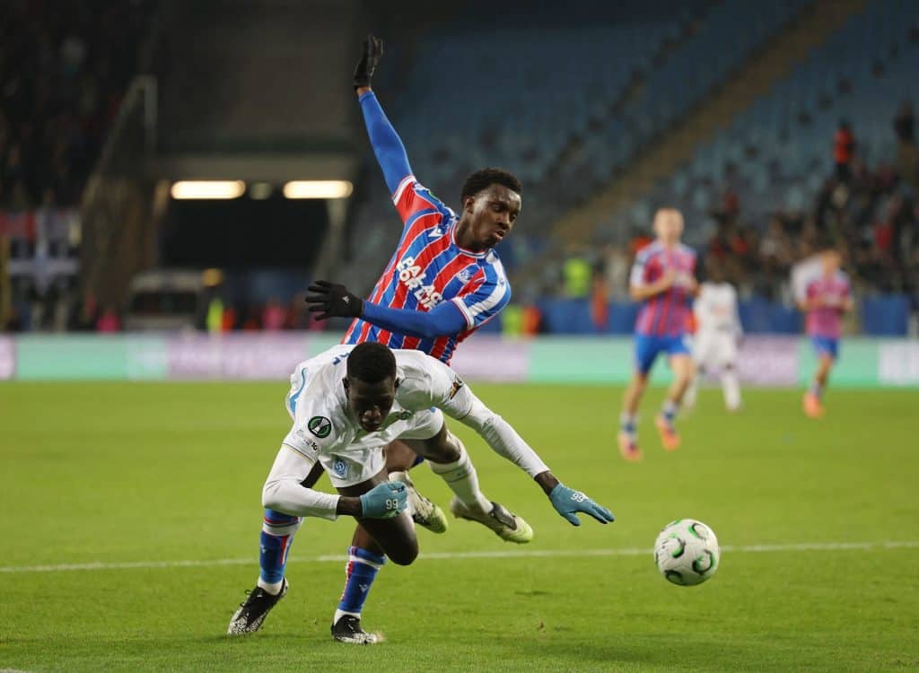 Super Sunday: Drama Awaits in the Premier League Vibrant football match capturing players in action on the field, showcasing athleticism and competitive spirit during an intense game at a stadium.