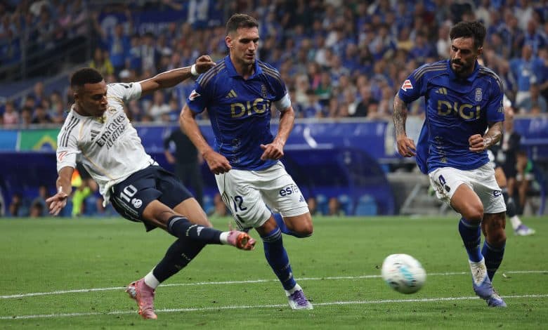 FIFA soccer match with players from Real Madrid and Estudiantes de La Plata competing on the field during a thrilling game.