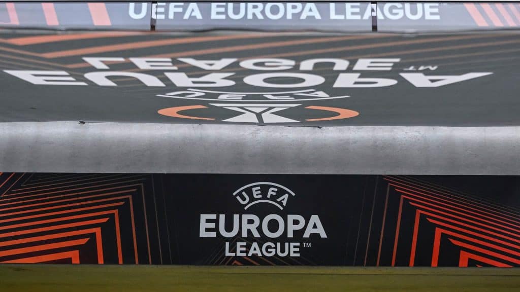 UEFA Europa League logo on a stadium advertising board during a football match, showcasing the official branding and modern graphic design elements.
