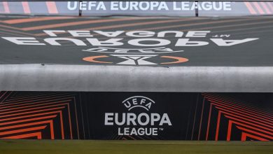 UEFA Europa League logo on a stadium advertising board during a football match, showcasing the official branding and modern graphic design elements.