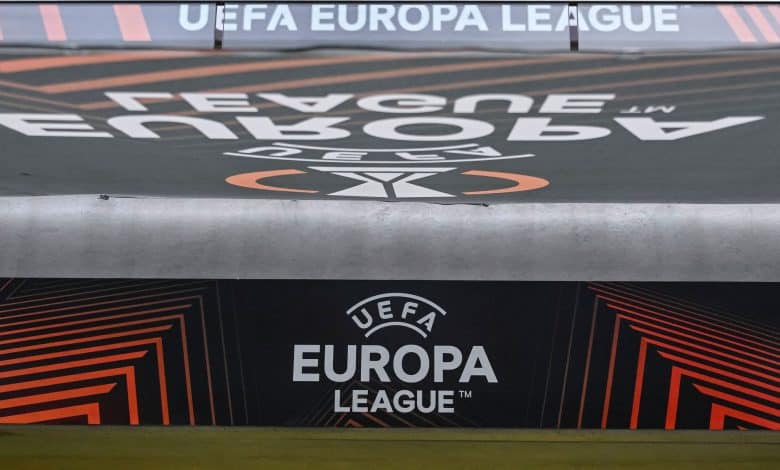 UEFA Europa League logo on a stadium advertising board during a football match, showcasing the official branding and modern graphic design elements.
