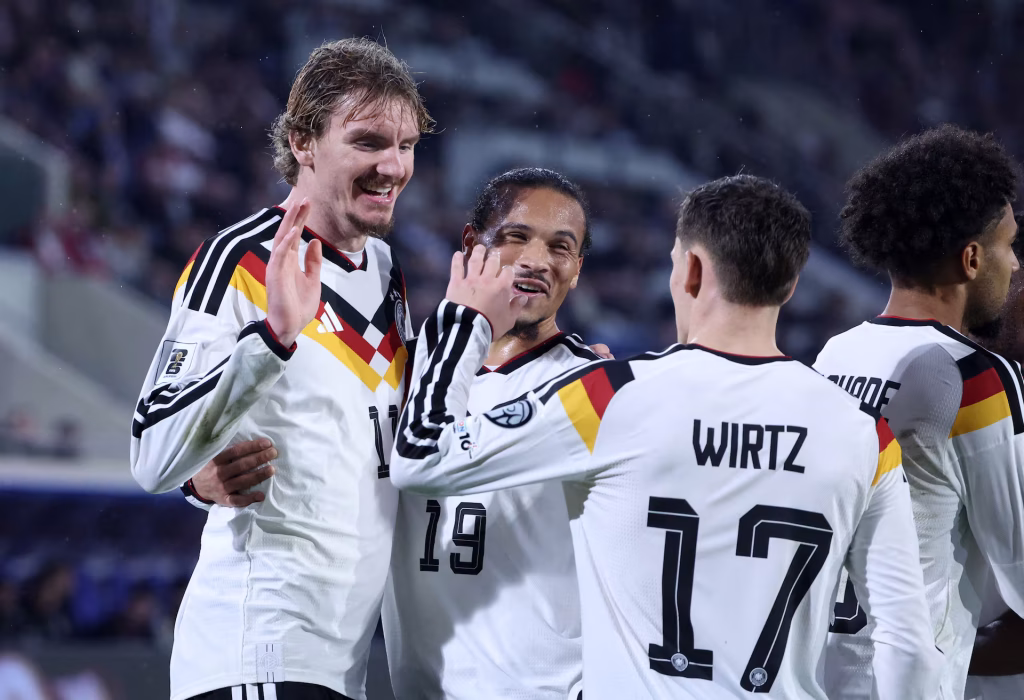 Germany stay top after Woltemade double
