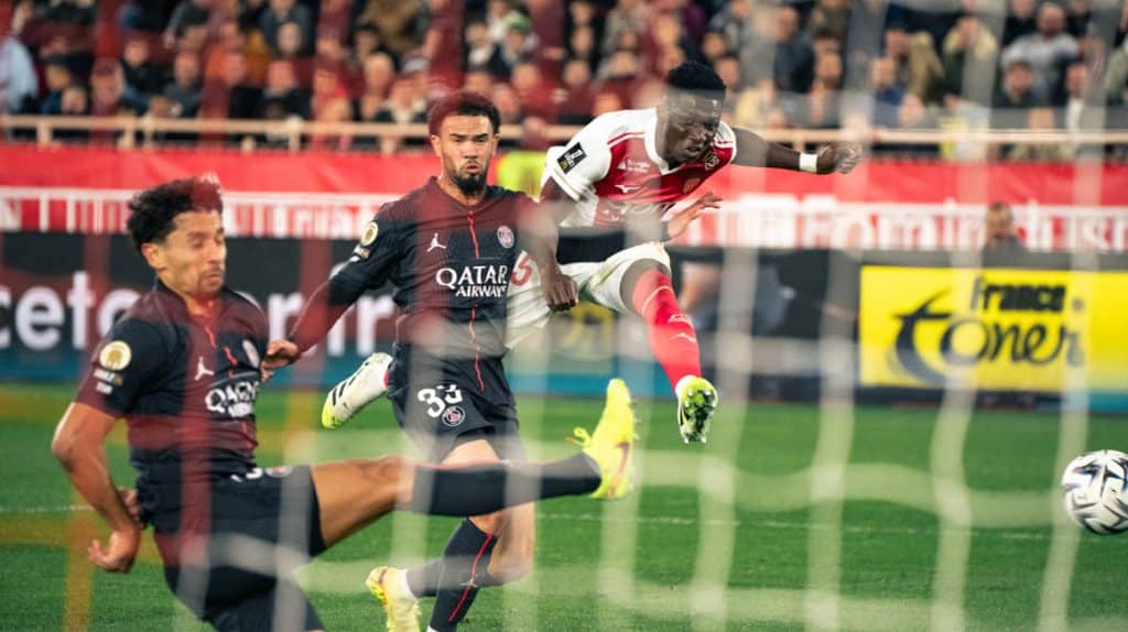 Exciting soccer action with players in motion during a competitive game.