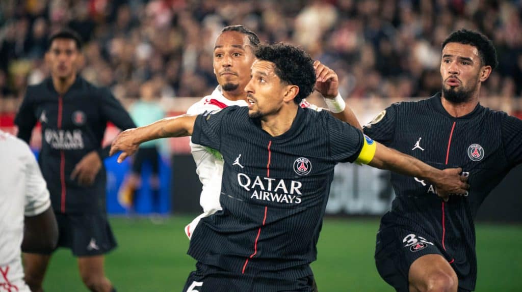 Celebrating football victory featuring PSG players in action; team sport, soccer celebration, professional football match, sports team, team unity, athletic competition, stadium atmosphere, player camaraderie, match winning moment.