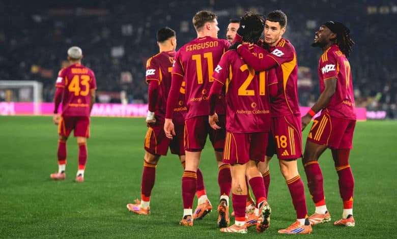 Soccer players in maroon and yellow uniforms celebrating strategy and teamwork.