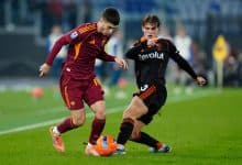 Athletes battling for ball during match.