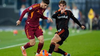 Athletes battling for ball during match.
