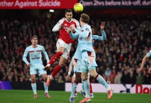 Arsenal stay in control of title race