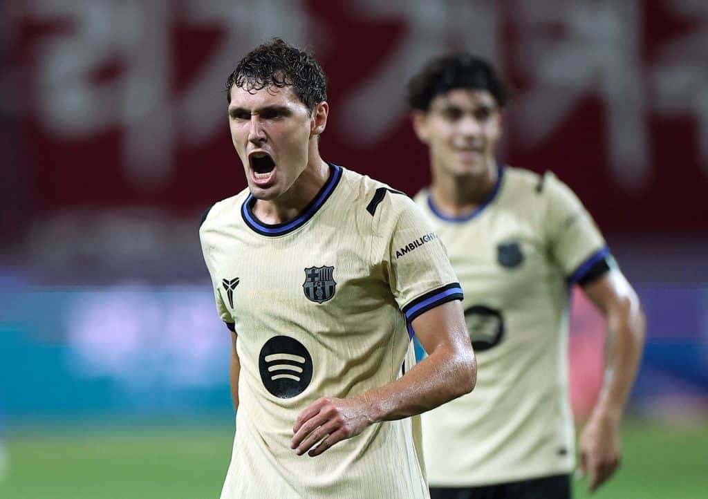 Player in intense moment during a football match, showing passion and determination.