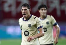 Player in intense moment during a football match, showing passion and determination.