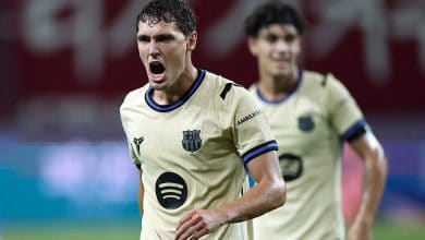 Player in intense moment during a football match, showing passion and determination.