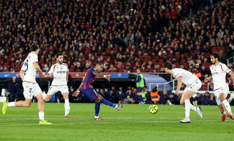 High-energy soccer game between FC Barcelona and opponents in white kits during a competitive match.