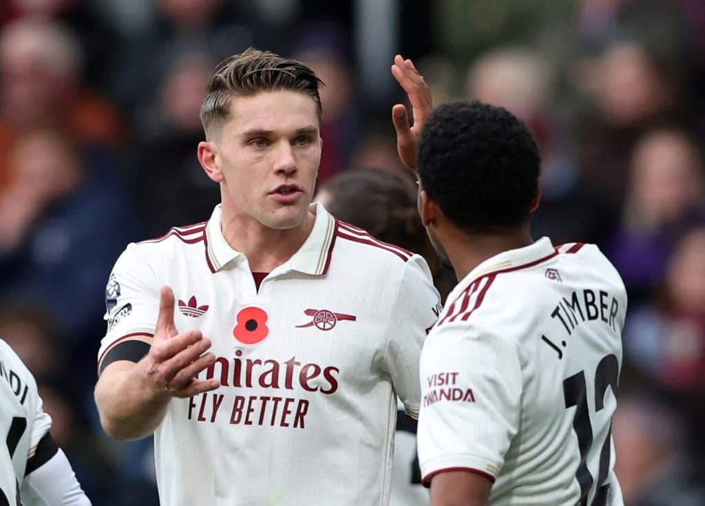 Young football players in an intense game, emphasizing teamwork and communication.