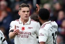 Young football players in an intense game, emphasizing teamwork and communication.