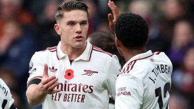 Young football players in an intense game, emphasizing teamwork and communication.