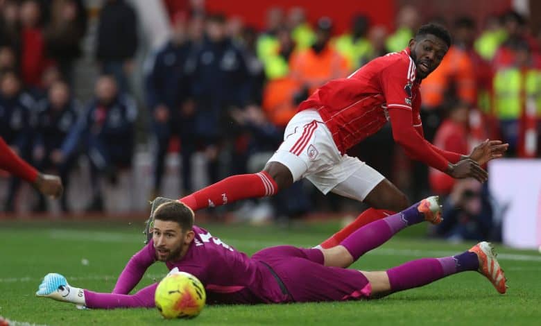 Dynamic soccer match with players competing intensely for the ball on the field.