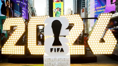 Colorful FIFA World Cup 2023 signage in Times Square, New York, with bright lights, billboards, and bustling crowd, showcasing international football excitement and major sports event highlights.