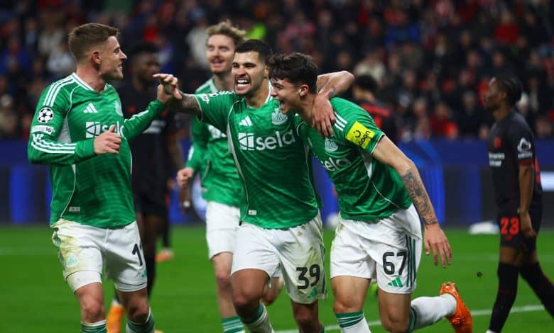 Soccer players celebrating after scoring a goal in a high-intensity match.