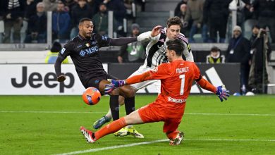 Professionals competing during a soccer match, emphasizing action and athleticism in sports.