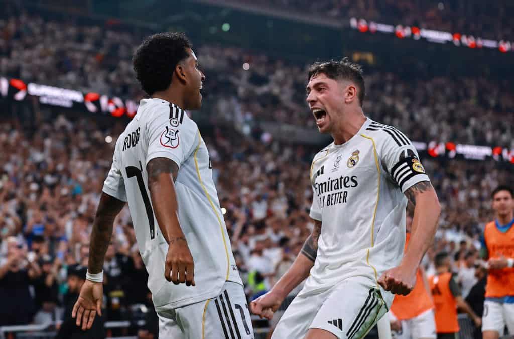 Celebrating goals and teamwork in La Liga football match.